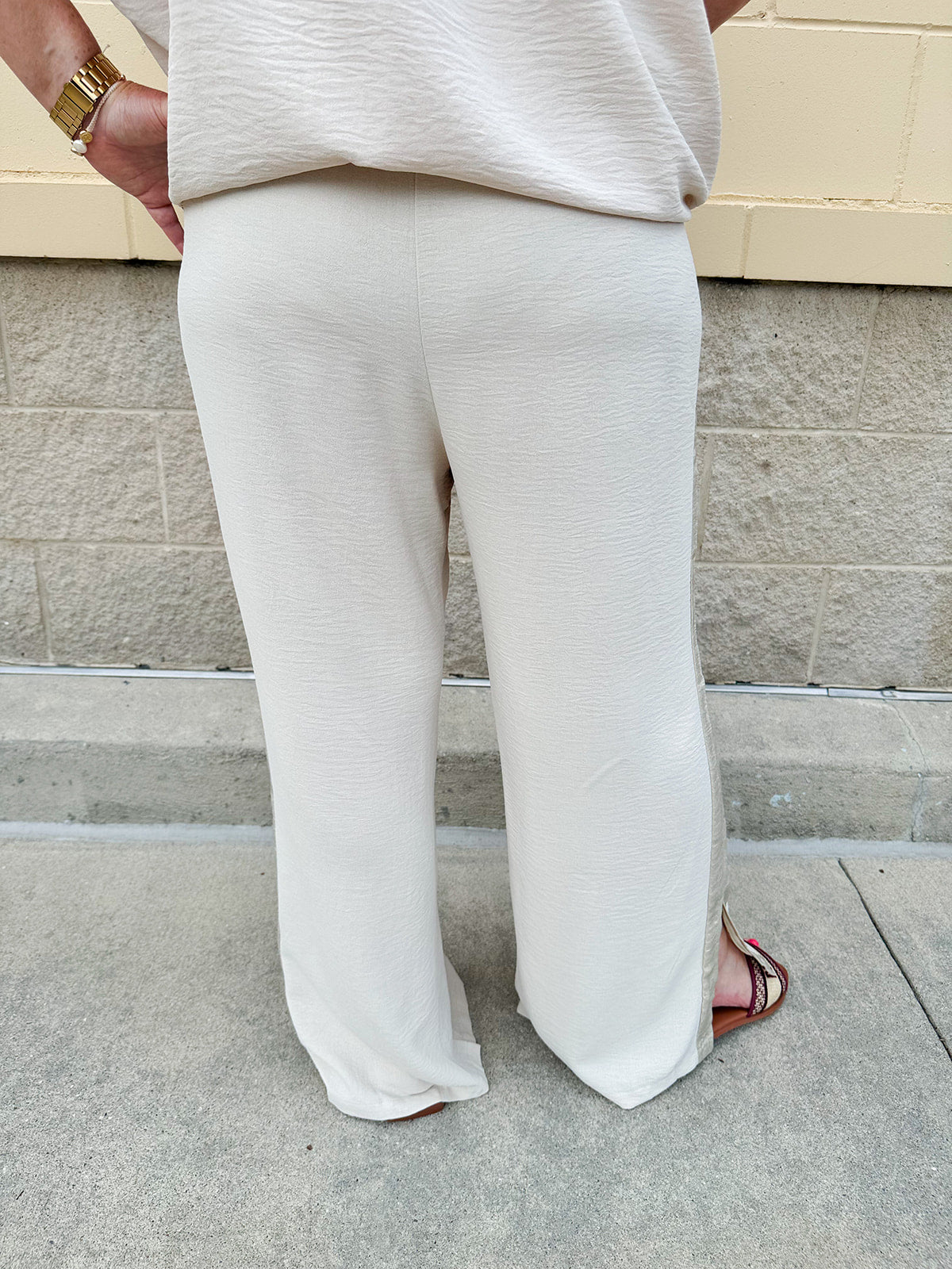 Oatmeal wide leg pants with gold side piping and drawstring waist
