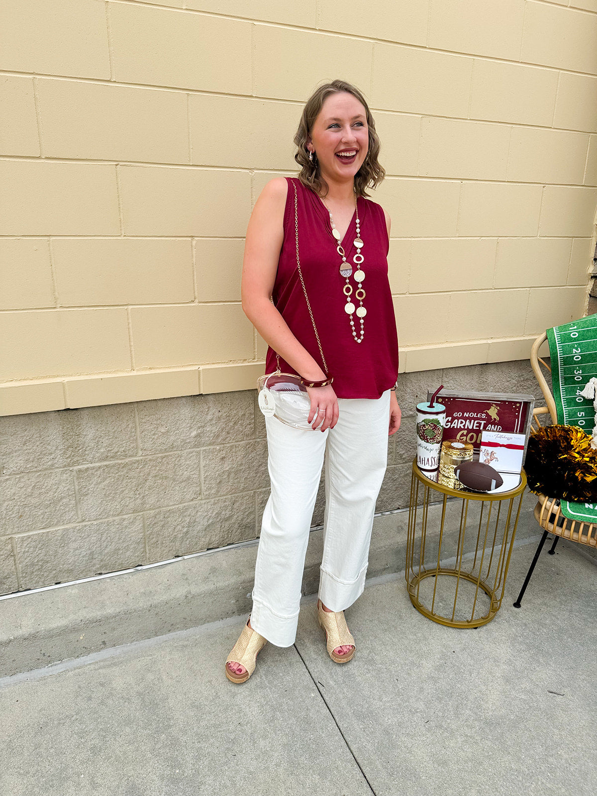 Garnet sleeveless V-neck tank top with pleated neckline detail and a relaxed, lightweight fit—perfect for warm-weather gamedays.