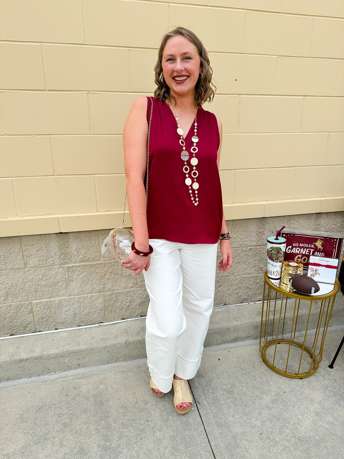 Garnet sleeveless V-neck tank top with pleated neckline detail and a relaxed, lightweight fit—perfect for warm-weather gamedays.