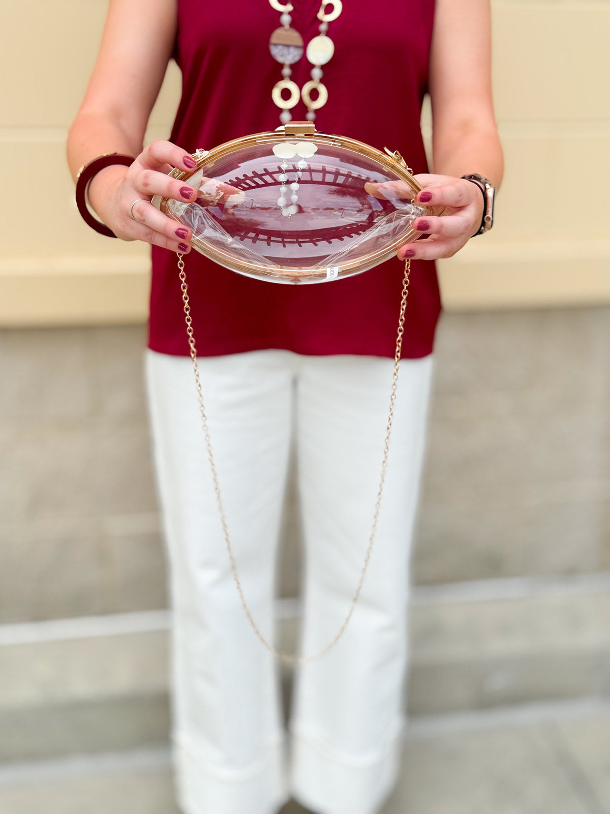Clear Football shaped Stadium Purse with gold chain.