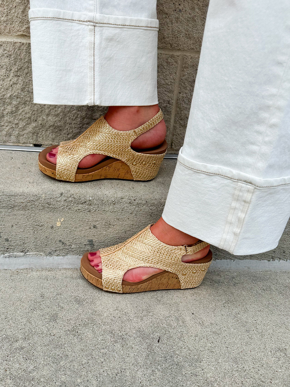 Light gold raffia cork wedges with gold rivets, Velcro heel strap, and a cushioned footbed