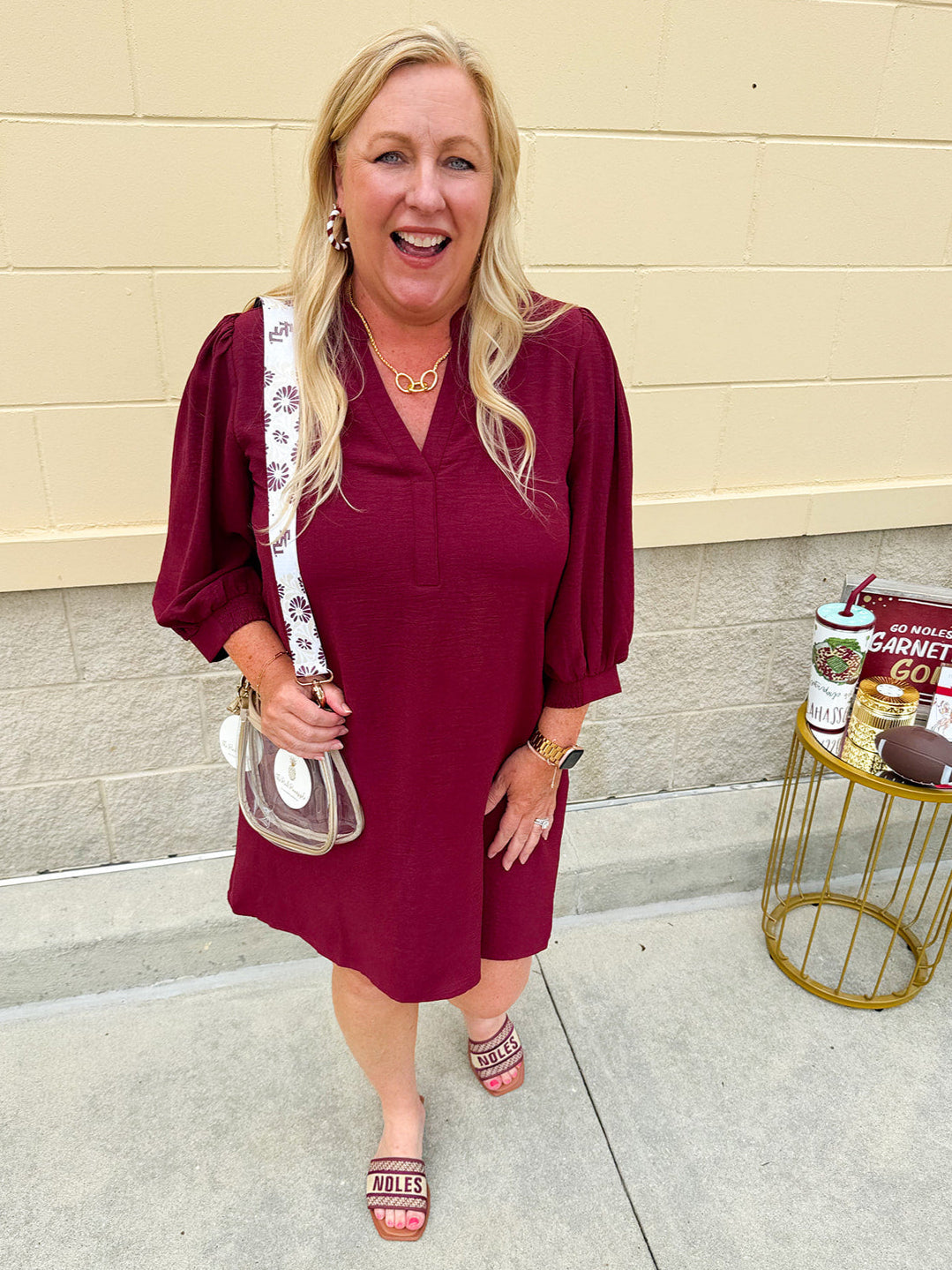 Garnet mini dress with a split U-neckline, flowy fit, and three-quarter peasant sleeves with banded cuffs. Lightweight and perfect for Gameday style.