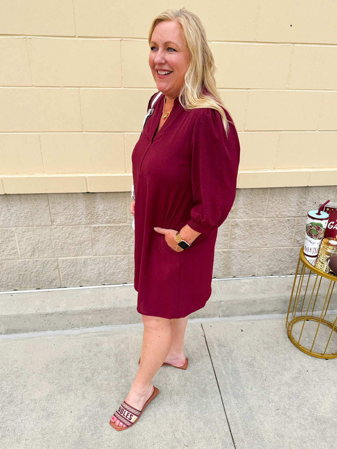Garnet short sleeve mini dress with deep V-neck, drop shoulders, and side pockets—perfect for gameday.