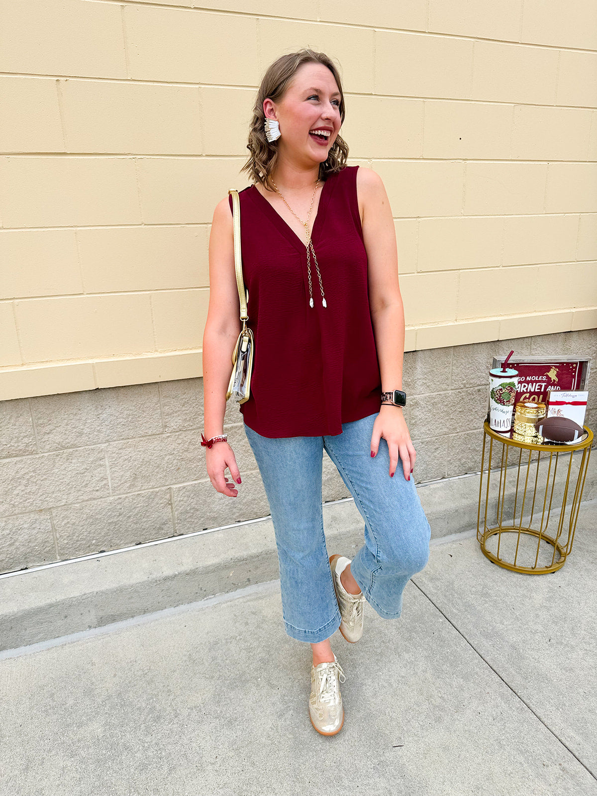 Garnet sleeveless V-neck tank with pleated detail at neckline, made in USA fabric.
