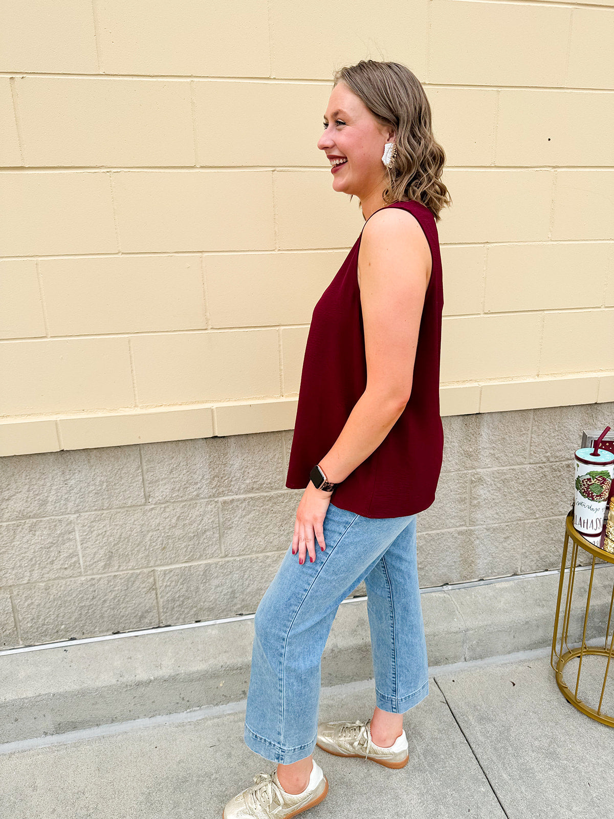 Garnet sleeveless V-neck tank with pleated detail at neckline, made in USA fabric.