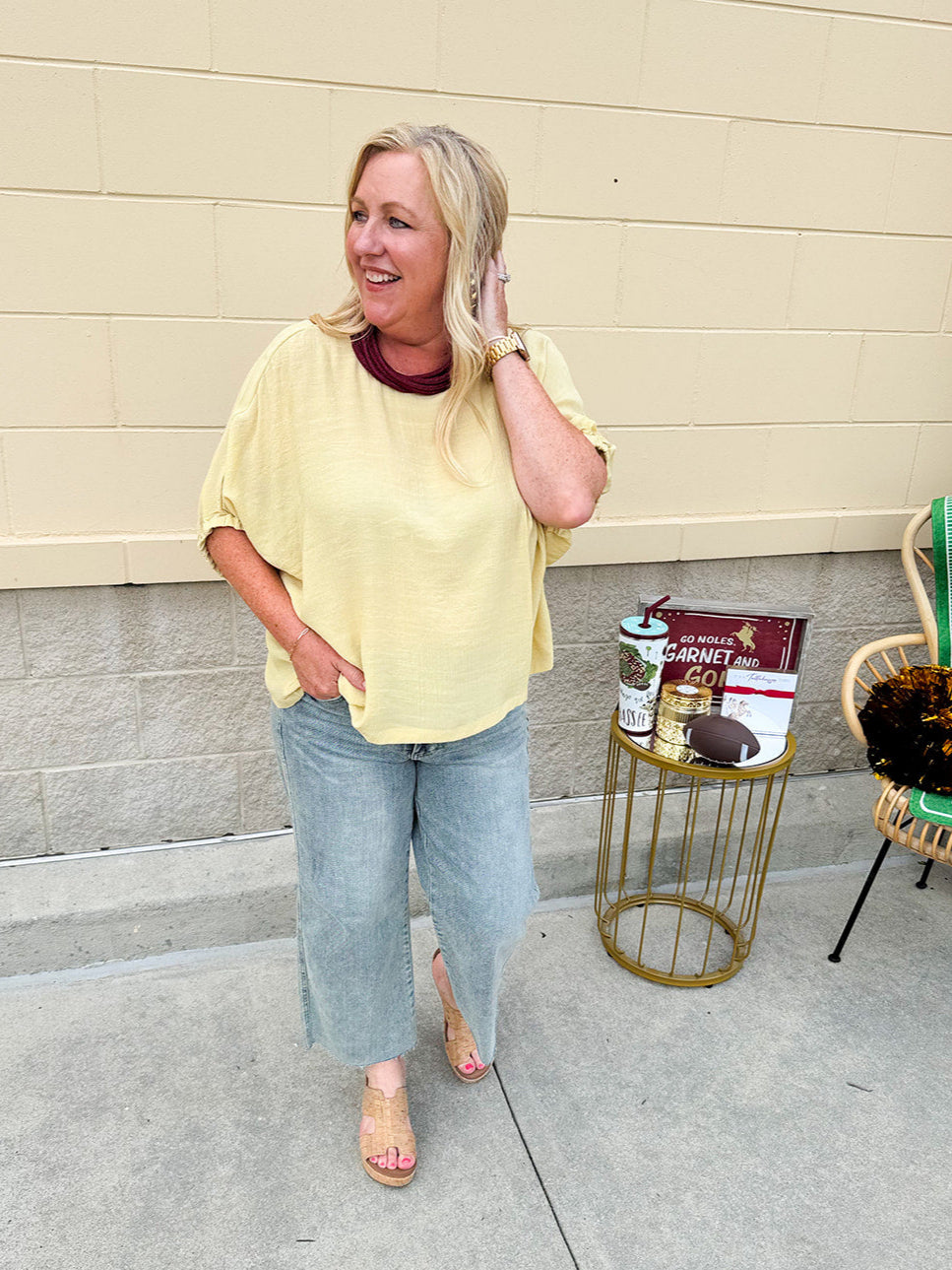 Golden yellow short sleeve blouse with a relaxed fit and dolman sleeves, styled for casual or dressy occasions.
