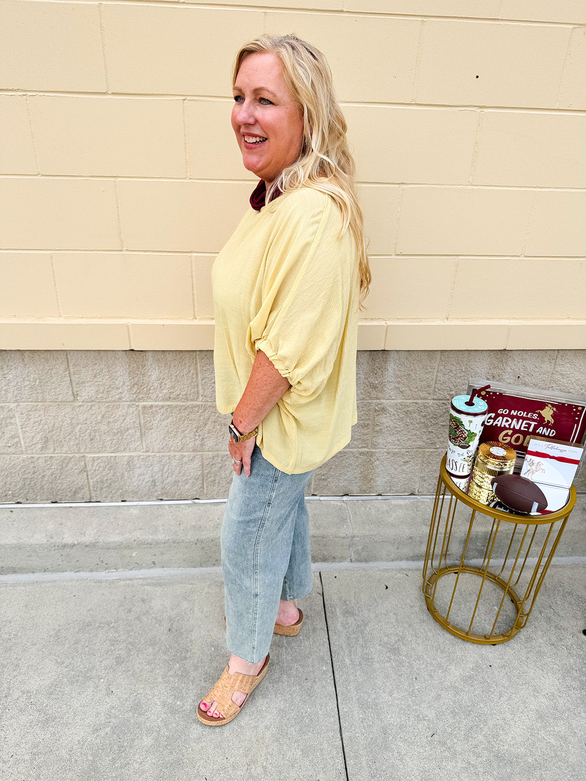 Golden yellow short sleeve blouse with a relaxed fit and dolman sleeves, styled for casual or dressy occasions.