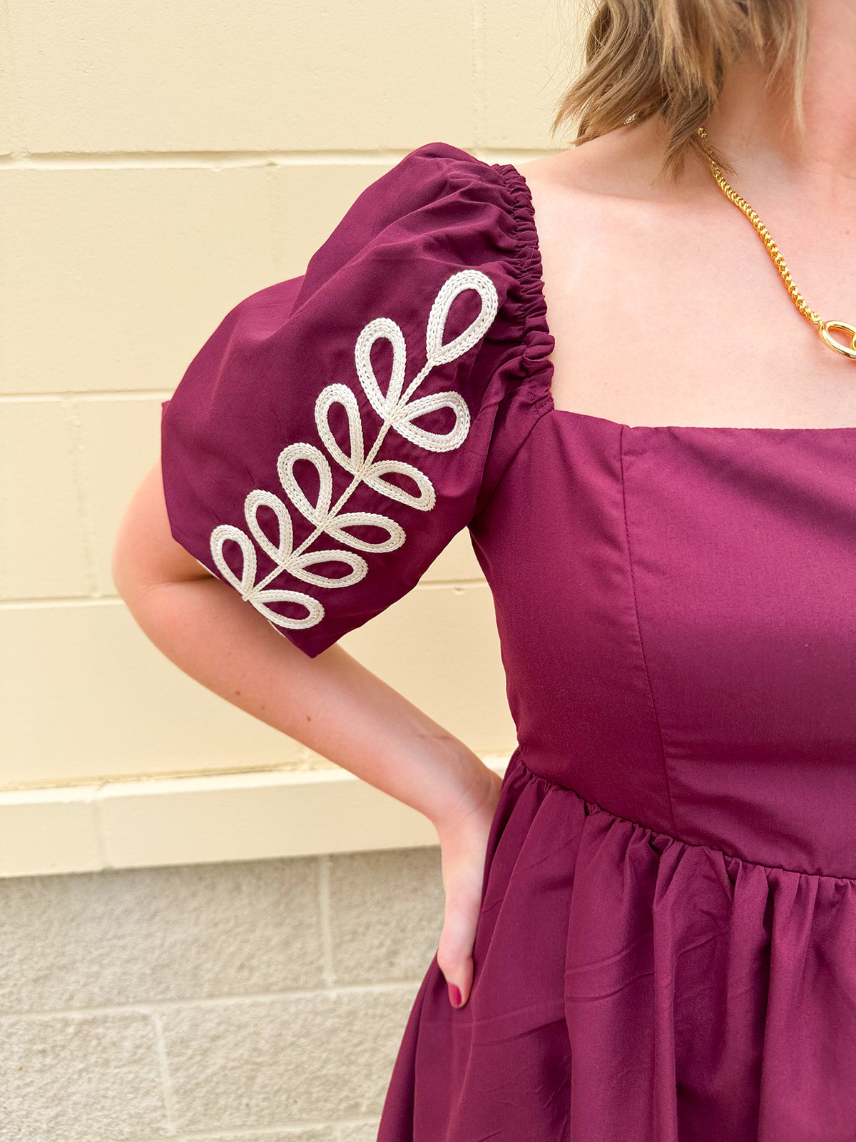 Garnet embroidered mini dress with puff sleeves, square neck, floral detailing, and scalloped hem—perfect for FSU gameday