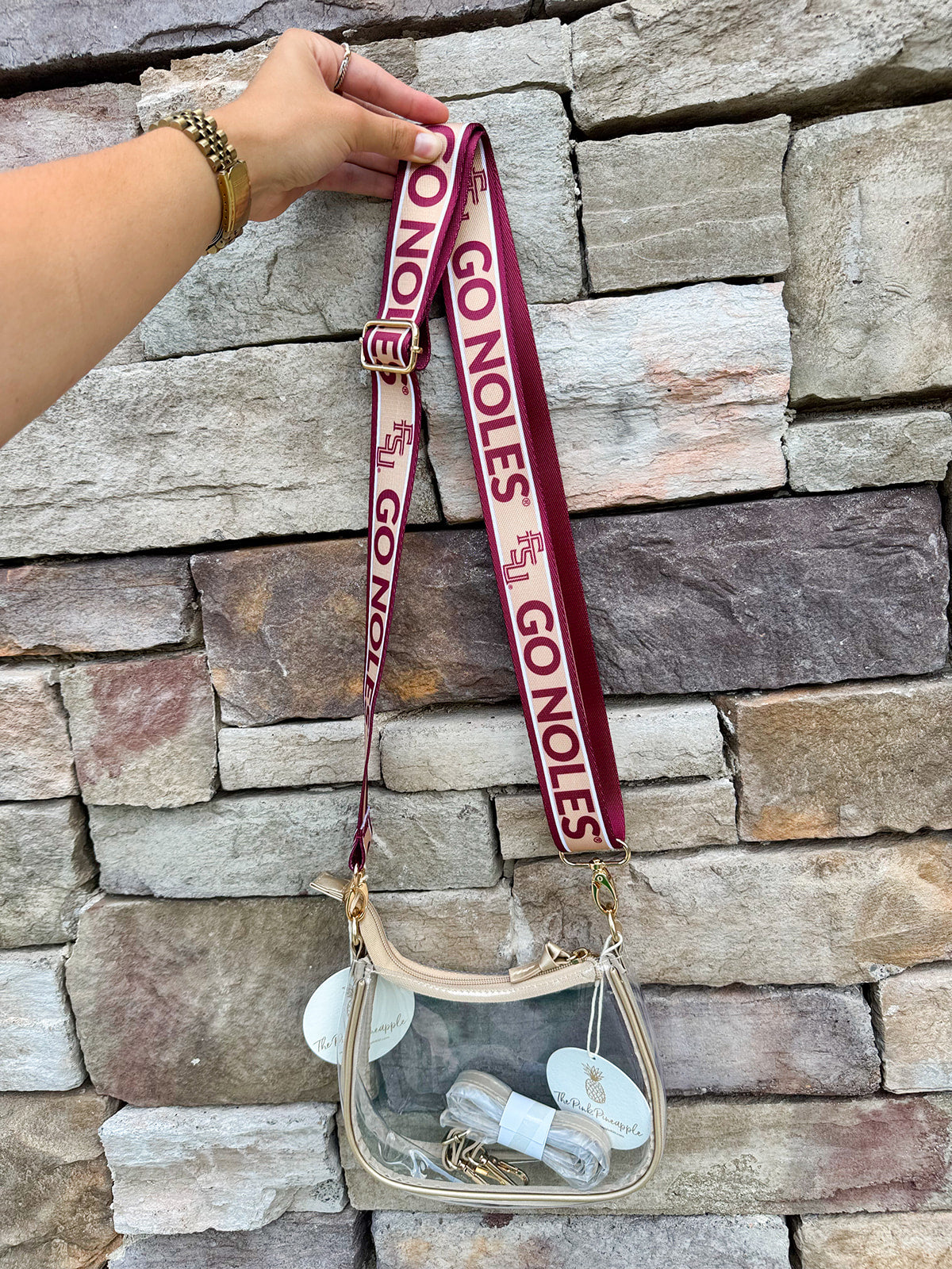 Garnet and gold printed purse strap with FSU and Go Noles lettering, reversible design with brass hardware.