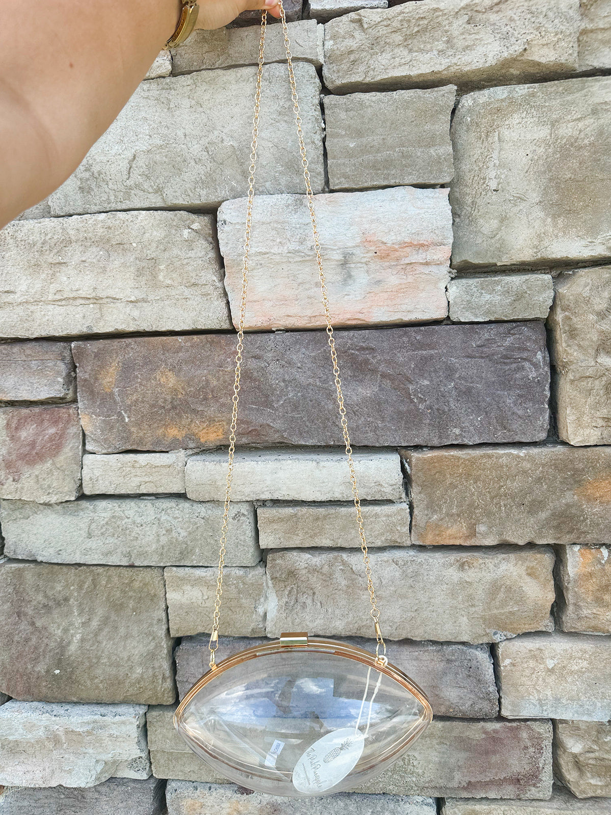 Clear Football shaped Stadium Purse with gold chain.