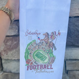 Cotton kitchen towel featuring Renegade, Osceola, and Doak Campbell Stadium-inspired artwork with garnet and gold detailing.
