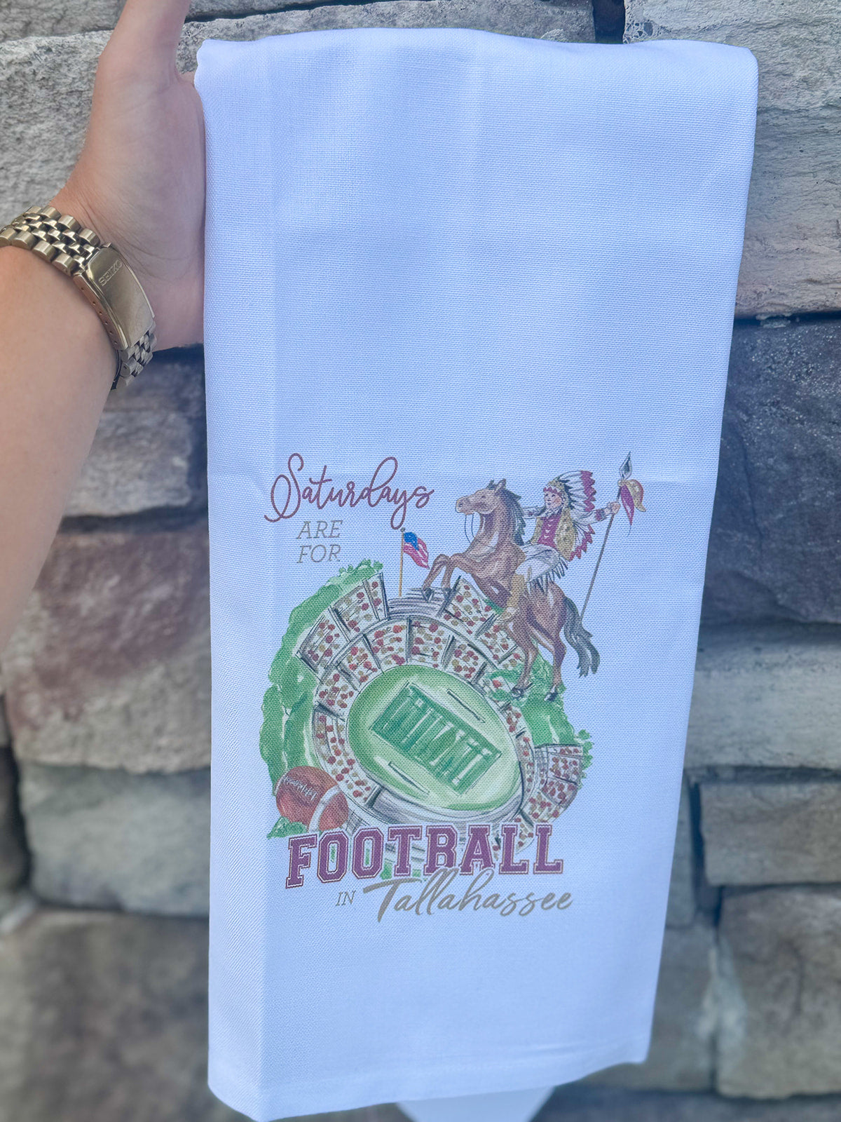 Cotton kitchen towel featuring Renegade, Osceola, and Doak Campbell Stadium-inspired artwork with garnet and gold detailing.