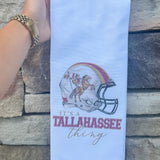 White cotton kitchen towel with painted football helmet featuring Osceola and Renegade, no border or edging.