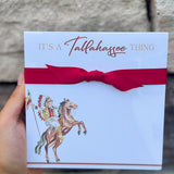 Square notepad with “It’s a Tallahassee Thing” in garnet and gold, gold edges, coordinating ribbon, and Osceola and Renegade illustration in the corner.