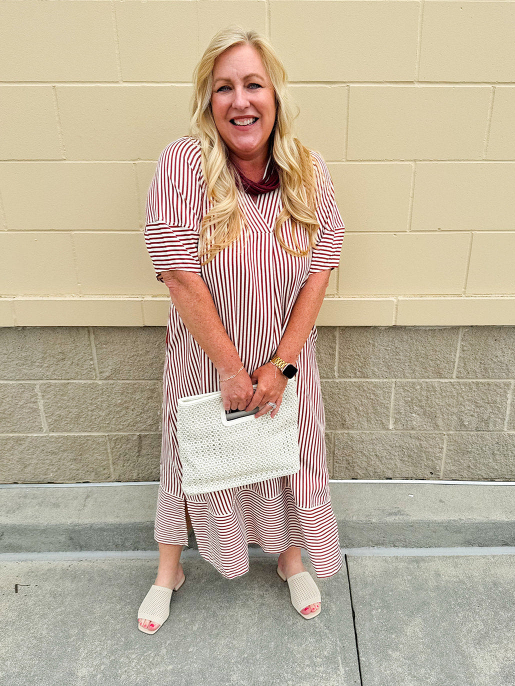 Garnet and cream striped midi dress with lantern sleeves, V-neckline, side slits, and horizontal stripe contrast at hem and sleeve cuffs