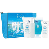 Aqua blue cotton cosmetic bag holding four travel-size Inis products: cologne, hand cream, shower gel, and body lotion.
