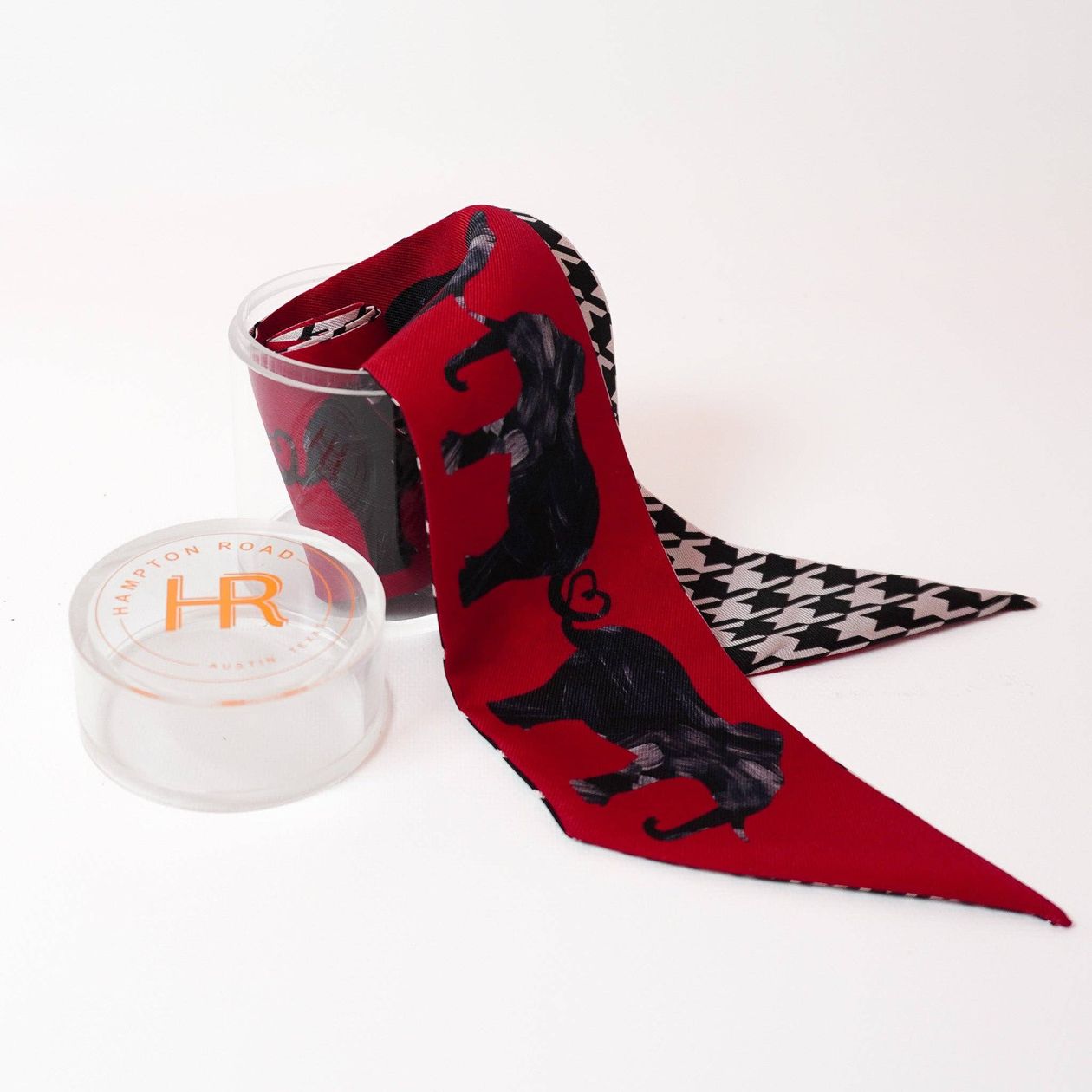 Double-sided silk twilly scarf with red tusk-inspired and black-and-white houndstooth prints