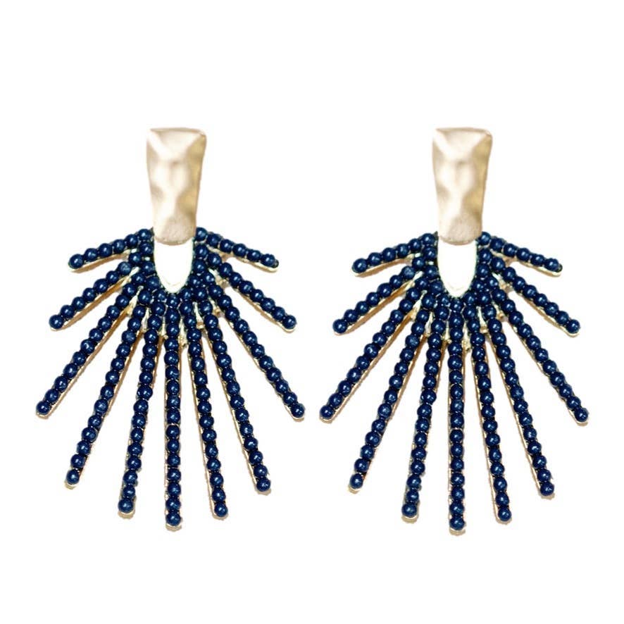 Navy statement drop earrings with a sunburst design, shown on a neutral background to highlight shine and shape
