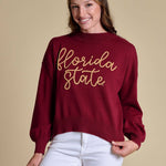 Garnet mock-neck sweater with “Florida State” embroidered in gold rope script across the front