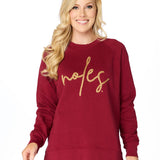 Garnet crewneck sweatshirt with gold braided rope embroidery spelling “Noles” on the front