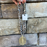 Cream, brown, and black leopard print scarf necklace with gold abstract pendant, handmade by Hart Designs.