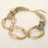 Short hammered metal link necklace with mesh scarf detail and adjustable clasp.