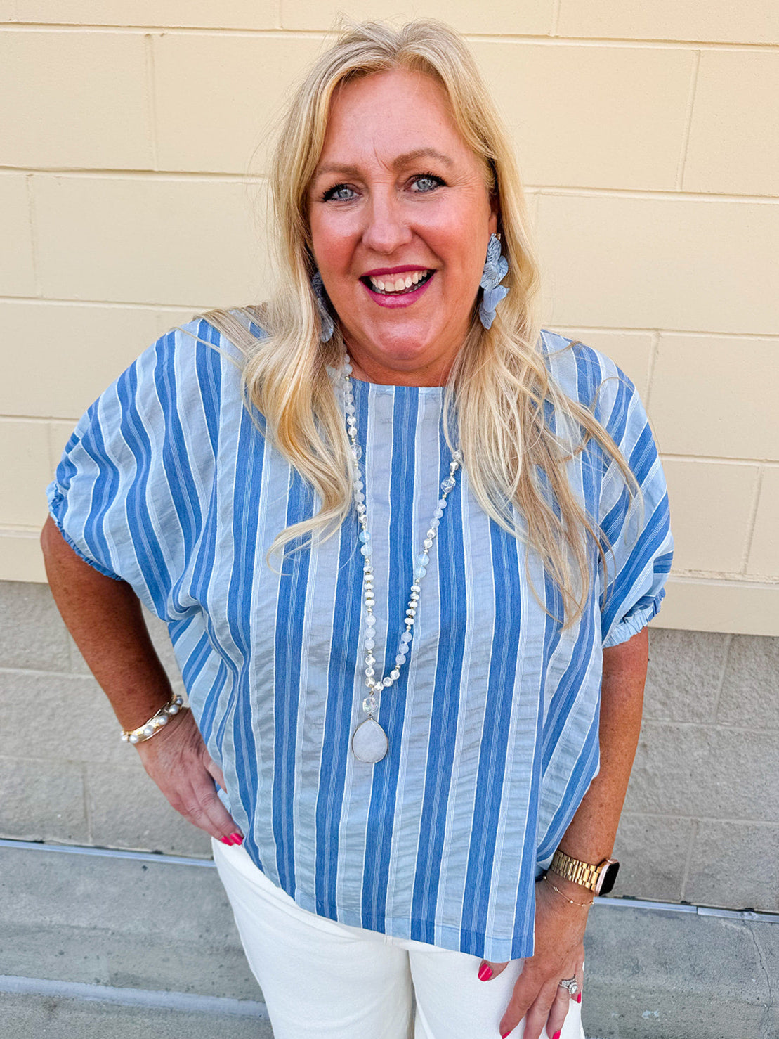 Model wearing the Picnic Chic Round Neck Striped Top featuring dolman sleeves, elastic cuffs, and a slightly boxy silhouette – styled for an effortless summer look perfect for picnics and casual outings