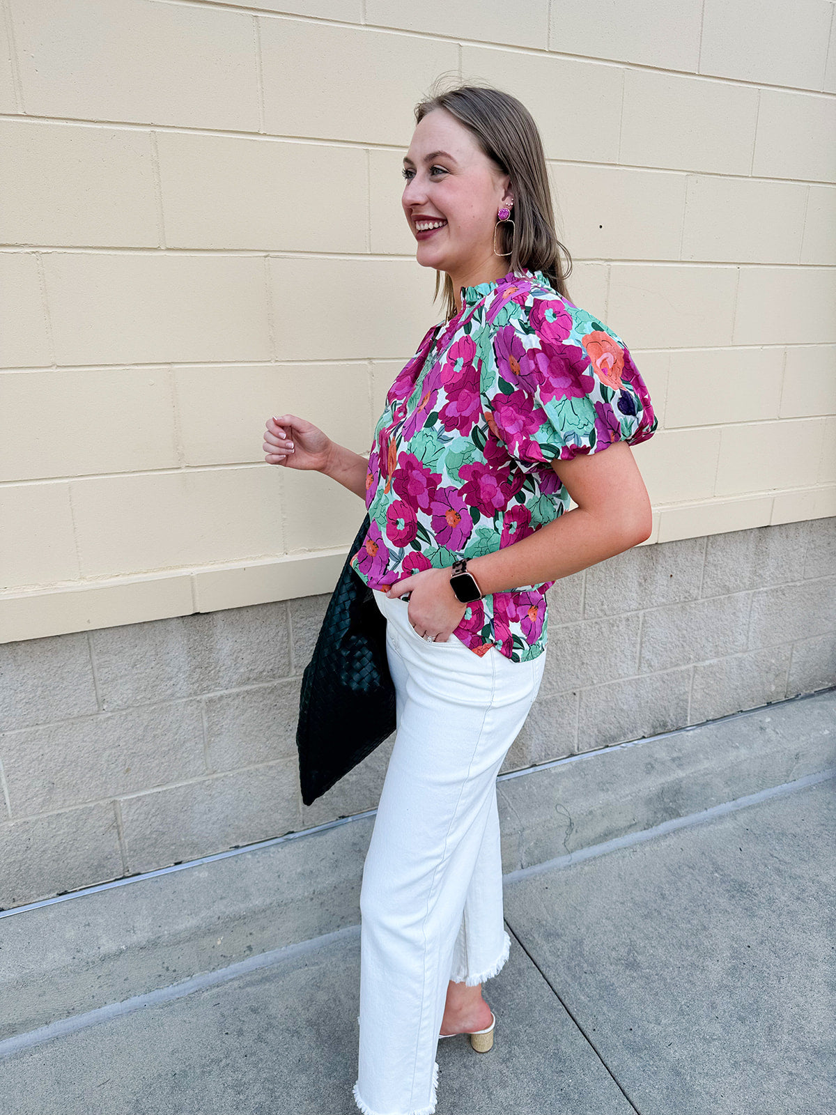 Vibrant raspberry floral blouse with ruffle-trimmed split neckline and short puff sleeves