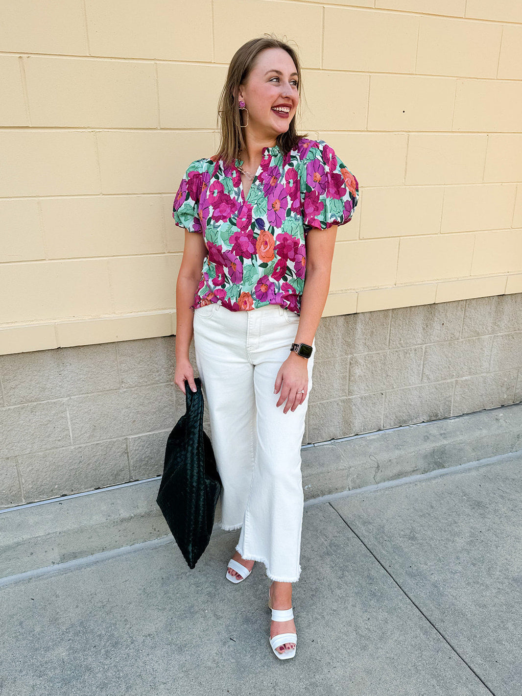 Vibrant raspberry floral blouse with ruffle-trimmed split neckline and short puff sleeves
