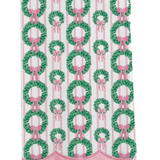 White Christmas tea towel with green wreaths, pink bows, pink stripes, and scalloped pink trim.