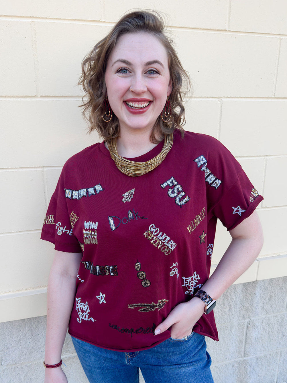 Garnet cap-sleeve crewneck top with sequined FSU logos and phrases on front and back