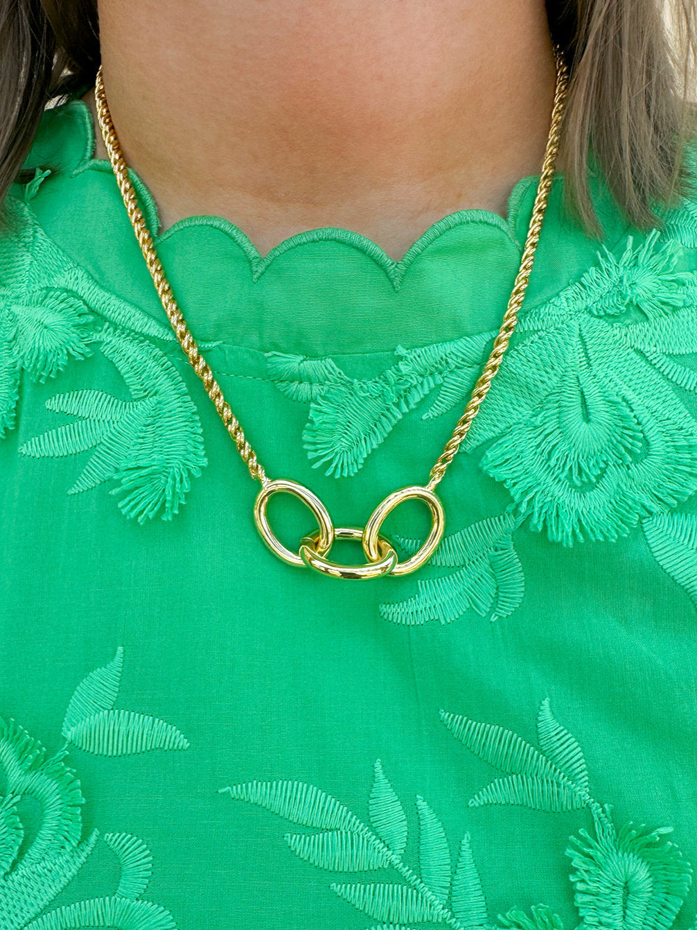 Gold-toned necklace with three statement chain links on a delicate rope chain—elegant, timeless, and made to last.