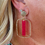 Rectangular hammered gold hoop earrings with transparent hot pink acrylic stick drop, designed by Taylor Shaye.