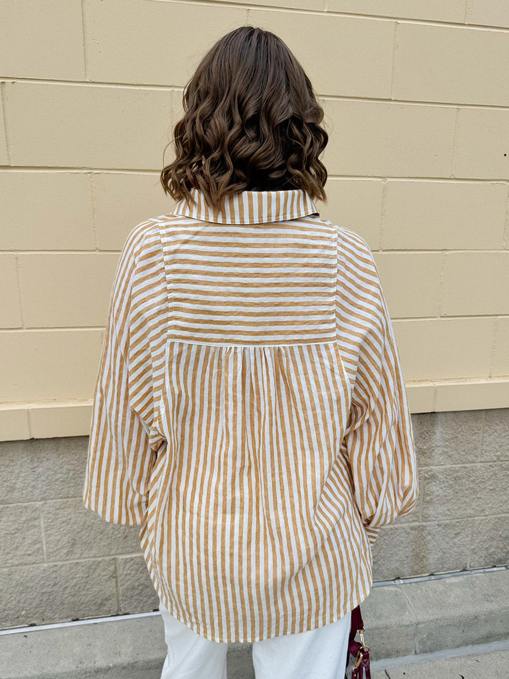 Tan and off-white striped long sleeve button-down shirt with collared neckline and cuffed sleeves—lightweight and perfect for layering