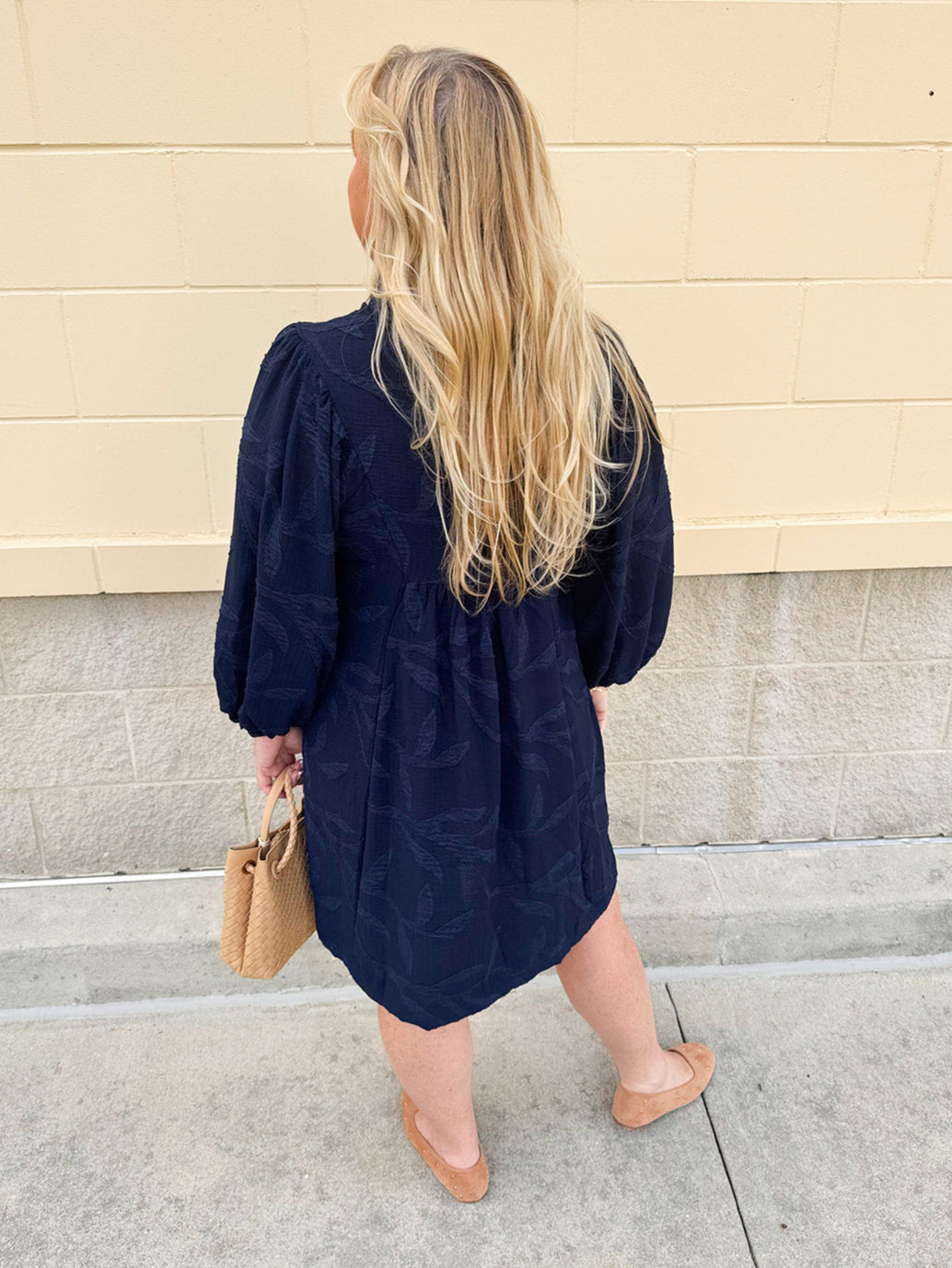 Navy embroidered mini dress with v-neck, ruffle collar, and ¾-length cuffed sleeves