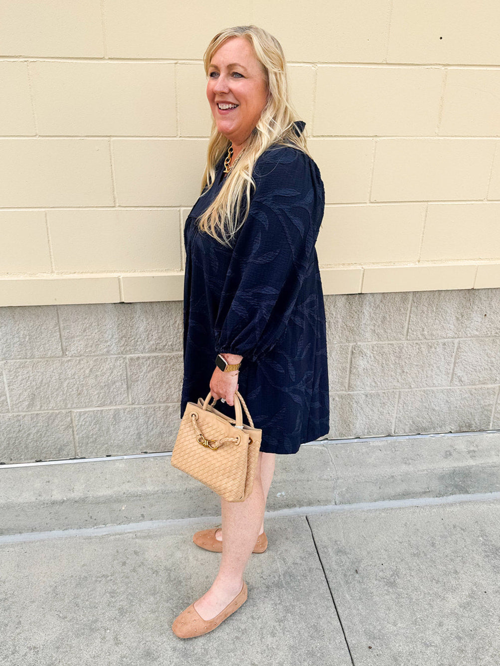 Navy embroidered mini dress with v-neck, ruffle collar, and ¾-length cuffed sleeves
