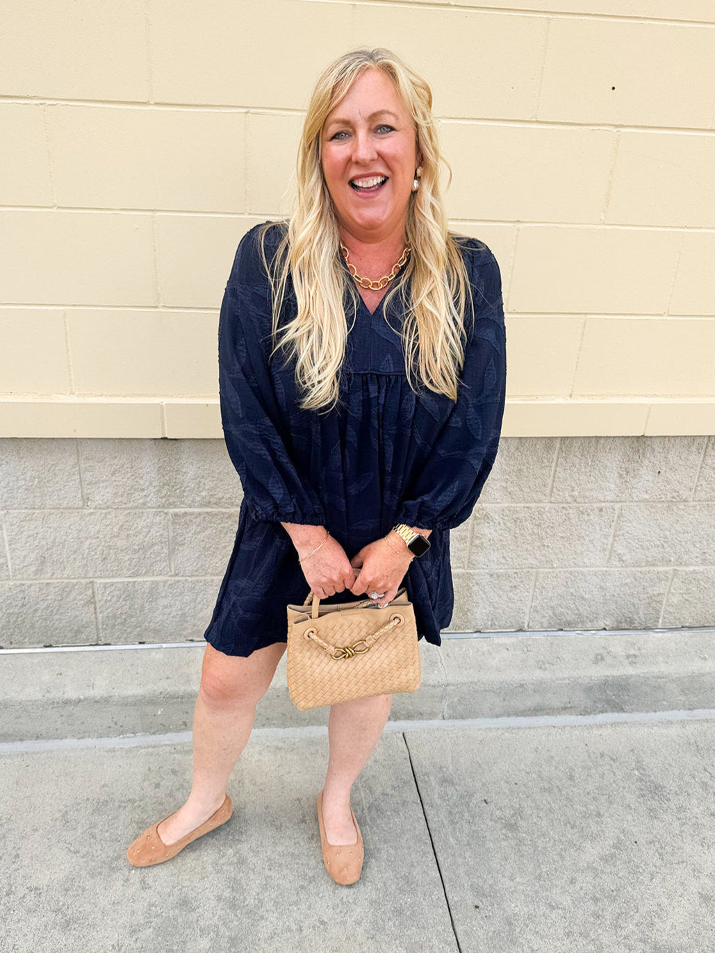 Navy embroidered mini dress with v-neck, ruffle collar, and ¾-length cuffed sleeves