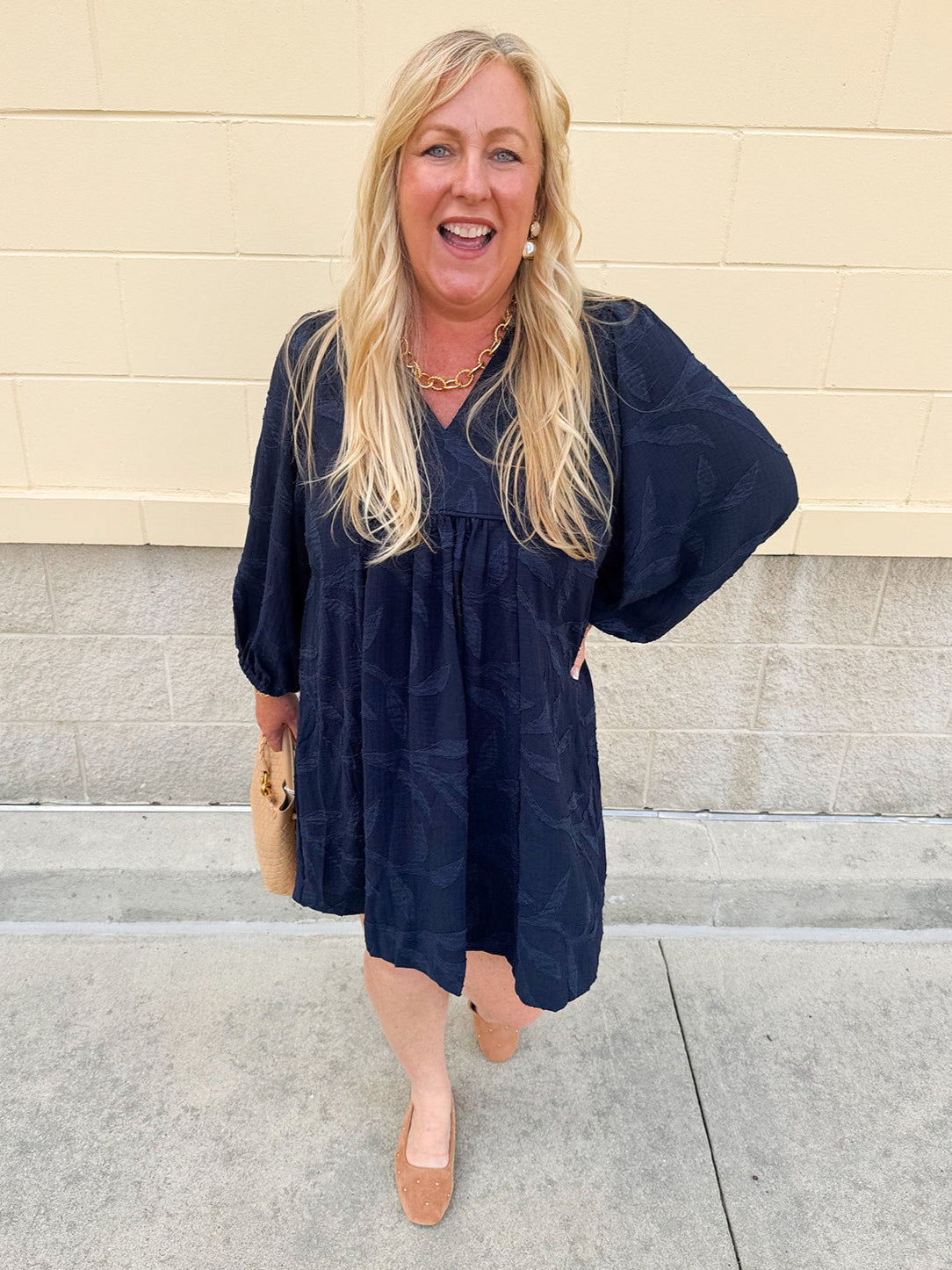 Navy embroidered mini dress with v-neck, ruffle collar, and ¾-length cuffed sleeves