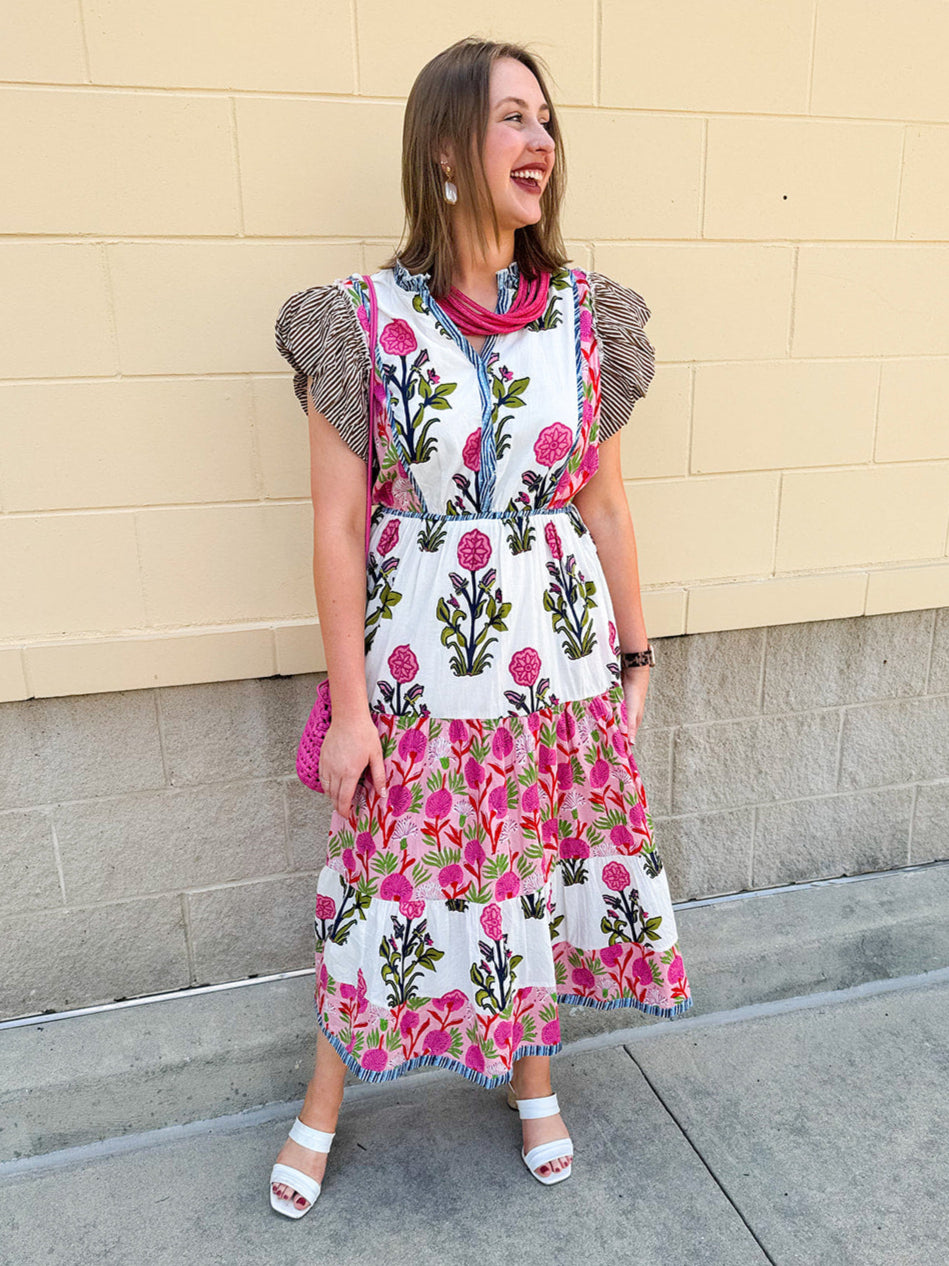 White cotton floral tiered maxi dress with flutter sleeves and ruffle collar