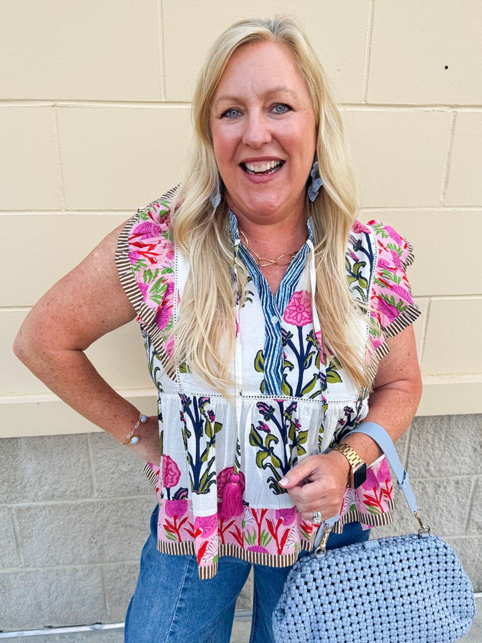 White cotton flutter sleeve top with floral print and ruffle neckline