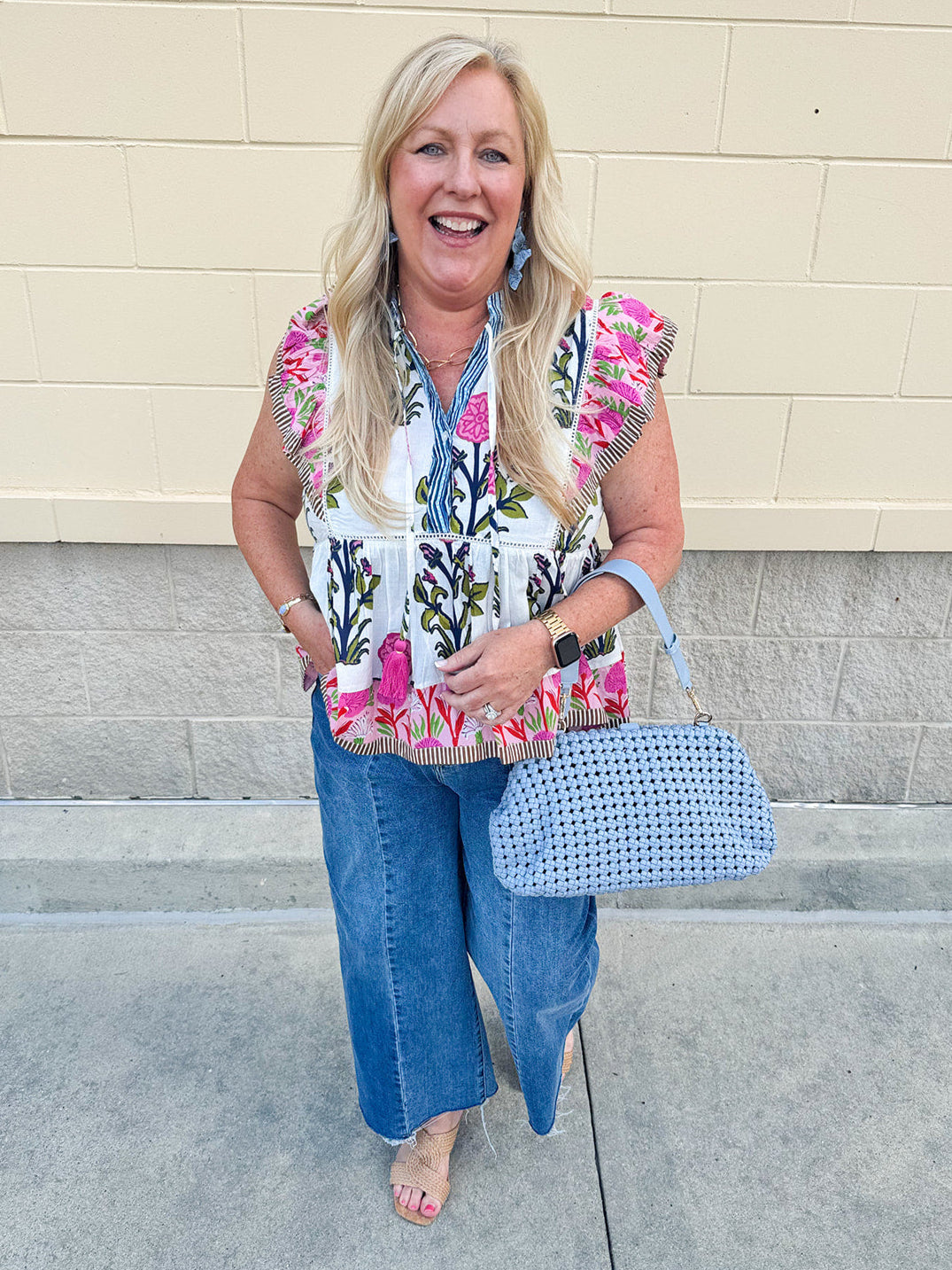 White cotton flutter sleeve top with floral print and ruffle neckline
