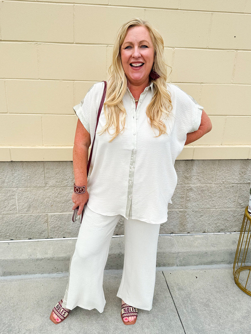 Oatmeal button-down top with gold trim, relaxed fit