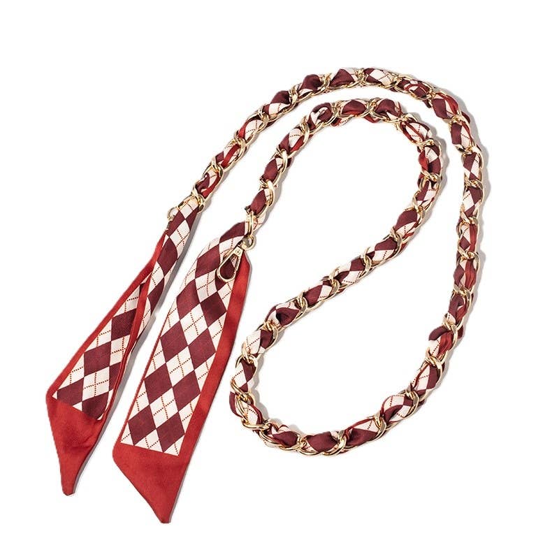 Garnet-bordered cream and deep garnet argyle scarf woven through gold chain bag strap with clasps.
