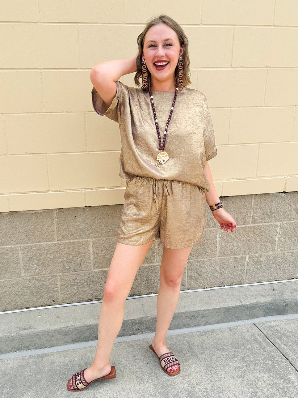 Metallic gold loungewear set with short dolman sleeve U-neck top and matching drawstring shorts