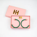 Kelly green acrylic hoop earrings with 2-inch diameter—lightweight and bold statement accessory
