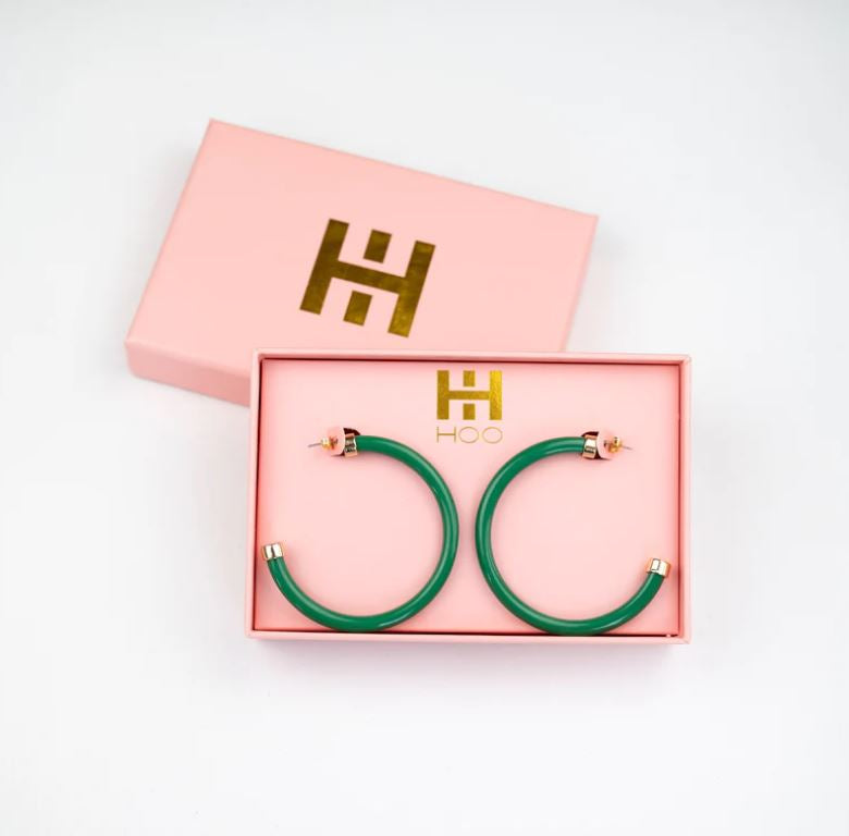 Kelly green acrylic hoop earrings with 2-inch diameter—lightweight and bold statement accessory