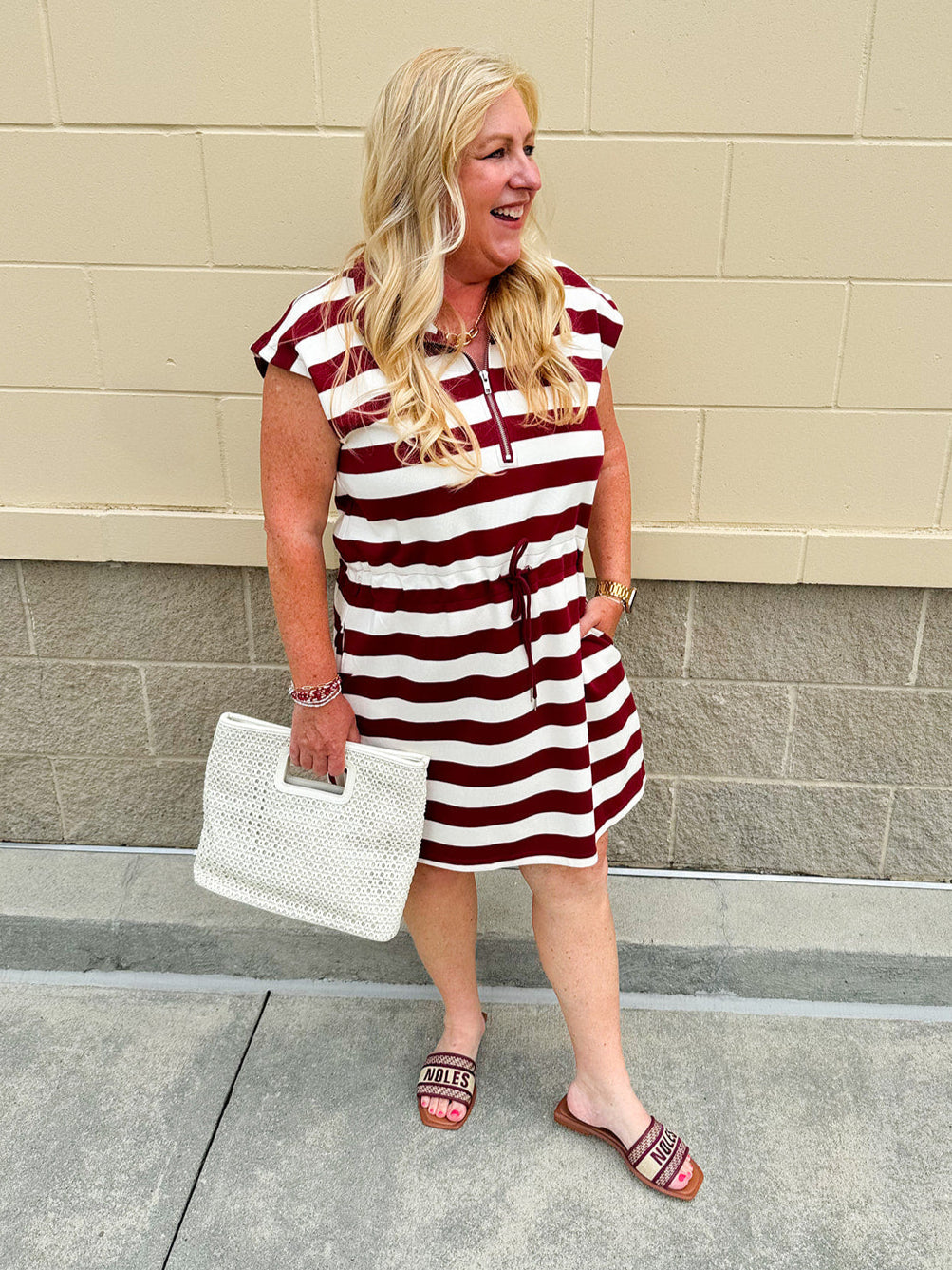 Garnet and cream striped zip-up mini dress with collar, drop sleeves, drawstring waist, and pockets—sporty and perfect for FSU gameday