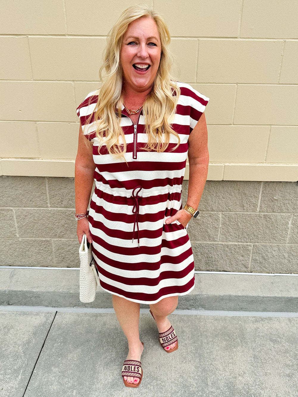 Garnet and cream striped zip-up mini dress with collar, drop sleeves, drawstring waist, and pockets—sporty and perfect for FSU gameday
