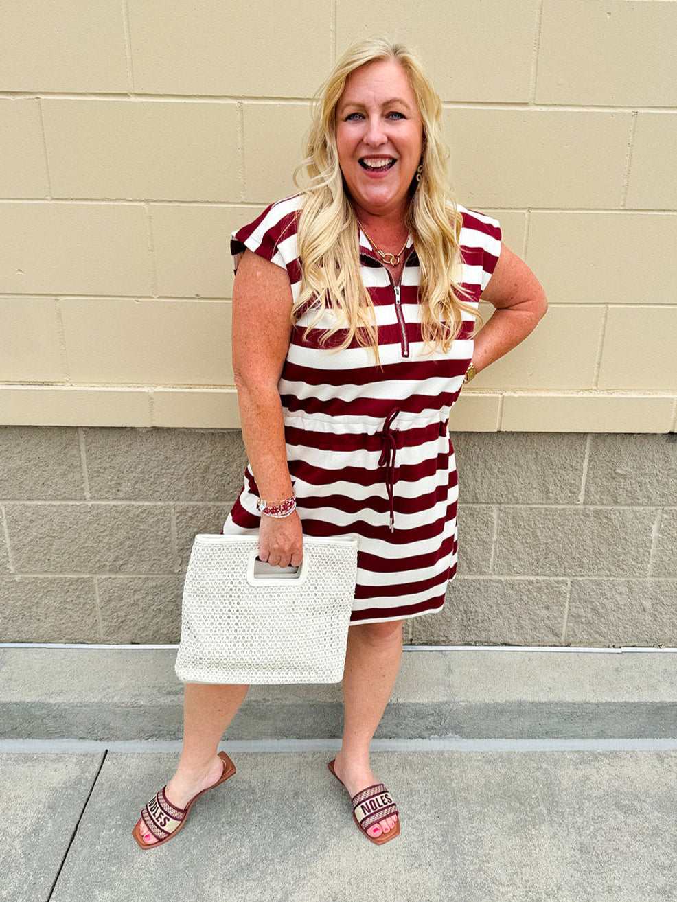 Garnet and cream striped zip-up mini dress with collar, drop sleeves, drawstring waist, and pockets—sporty and perfect for FSU gameday