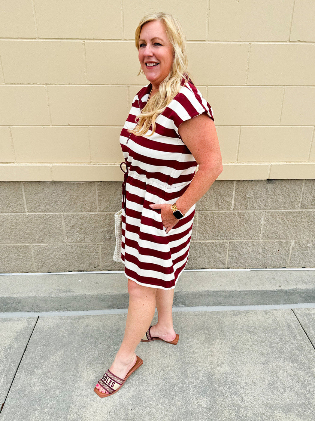 Garnet and cream striped zip-up mini dress with collar, drop sleeves, drawstring waist, and pockets—sporty and perfect for FSU gameday